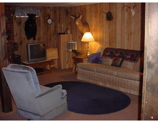 453 Keys Road Warren, MA 01585 - Photo 15 of 24 a living room with furniture and a fireplace