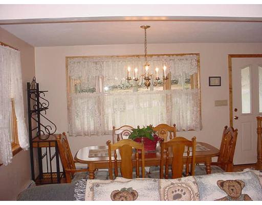 453 Keys Road Warren, MA 01585 - Photo 4 of 24 a dining room with furniture and chandelier