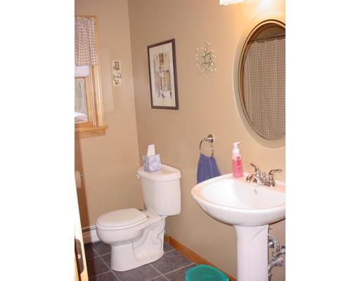453 Keys Road Warren, MA 01585 - Photo 8 of 24 a bathroom with a toilet sink and mirror