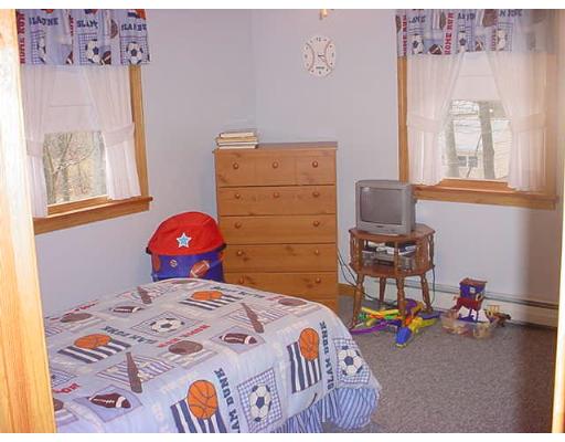 453 Keys Road Warren, MA 01585 - Photo 9 of 24 a bedroom with a bed and wooden floor