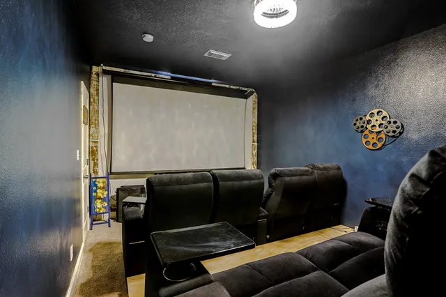 a blue chair sitting in a room next to a window