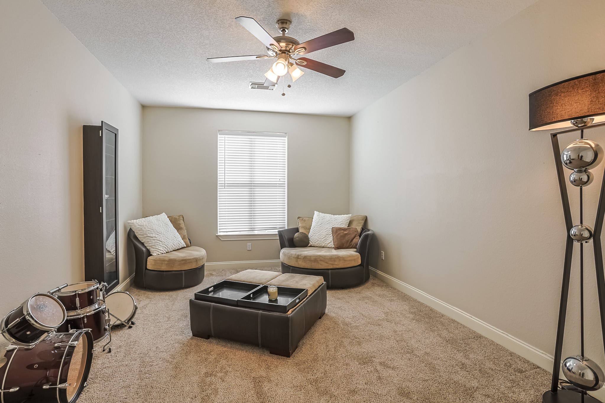 30119 West Geneva Drive Spring, TX 77386 - Photo 39 of 49 Flexible upstairs retreat with soft carpeting and natural light — ideal for a reading nook, play area, or creative space
