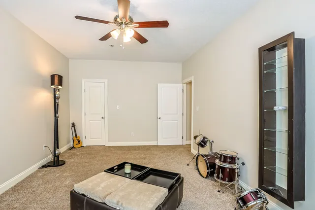 a room with furniture a rug and a window