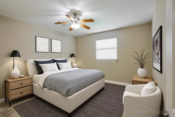 a bedroom with bed and window
