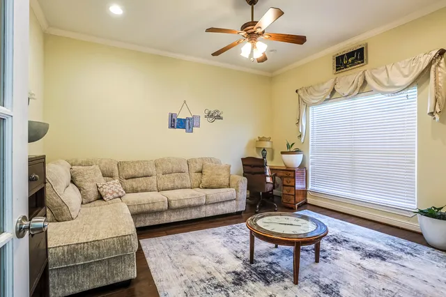 a living room with furniture and a rug