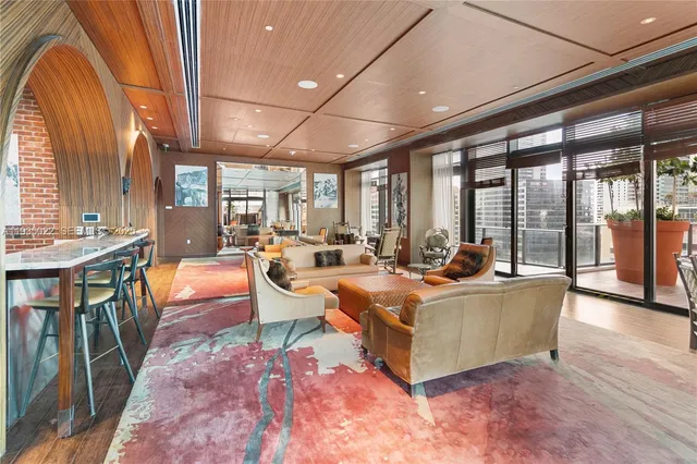 a projector room with furniture and a chandelier