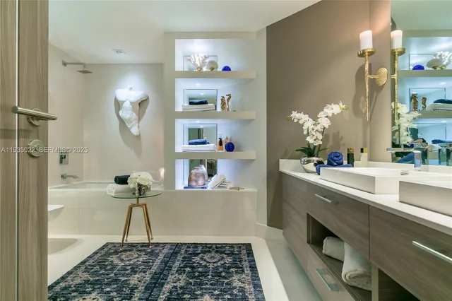 a room with a rug and a potted plant