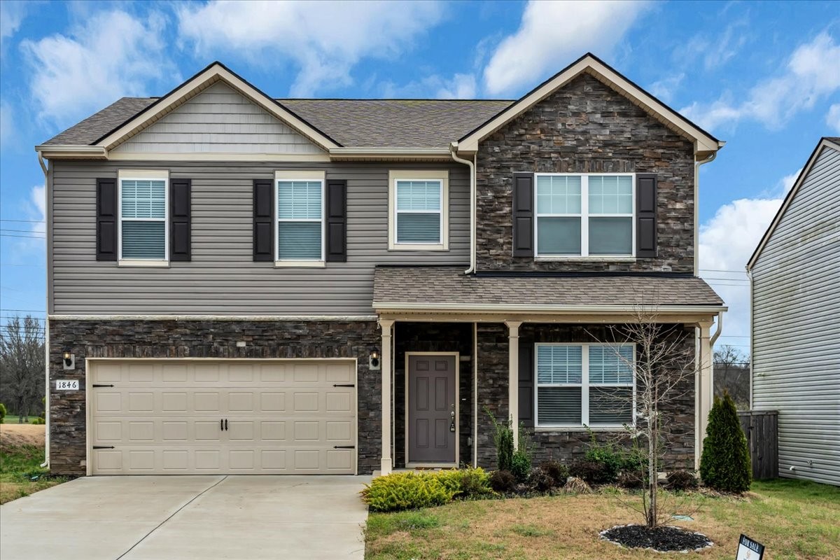 1846 Radnor Road Lebanon, TN 37087 - Photo 2 of 59 a front view of a house with a yard and garage