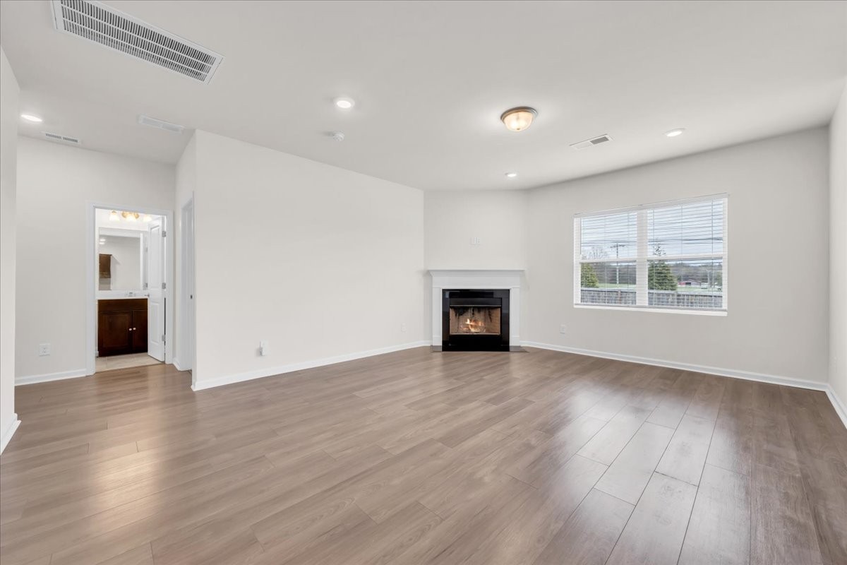 1846 Radnor Road Lebanon, TN 37087 - Photo 23 of 59 a view of an empty room with wooden floor and a window