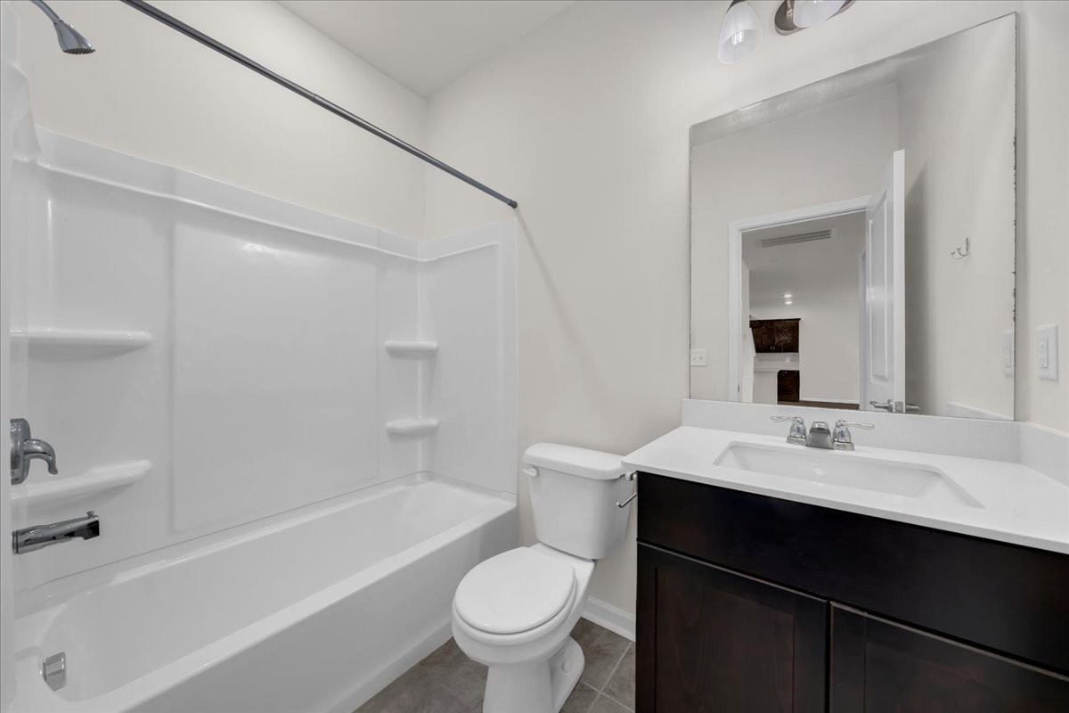 1846 Radnor Road Lebanon, TN 37087 - Photo 30 of 59 a bathroom with a sink a toilet and a bathtub