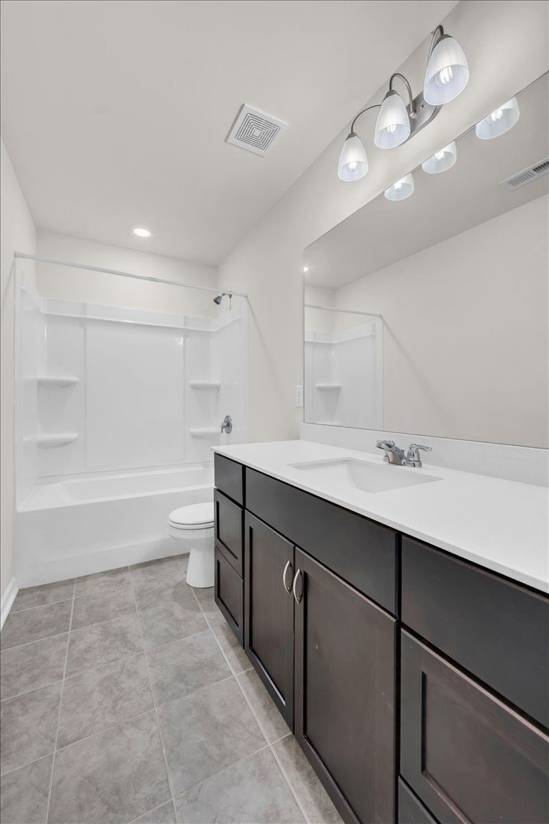 1846 Radnor Road Lebanon, TN 37087 - Photo 35 of 59 a bathroom with a sink a toilet a mirror and shower