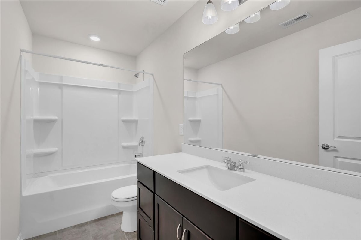 1846 Radnor Road Lebanon, TN 37087 - Photo 40 of 59 a bathroom with a sink a toilet a mirror and shower