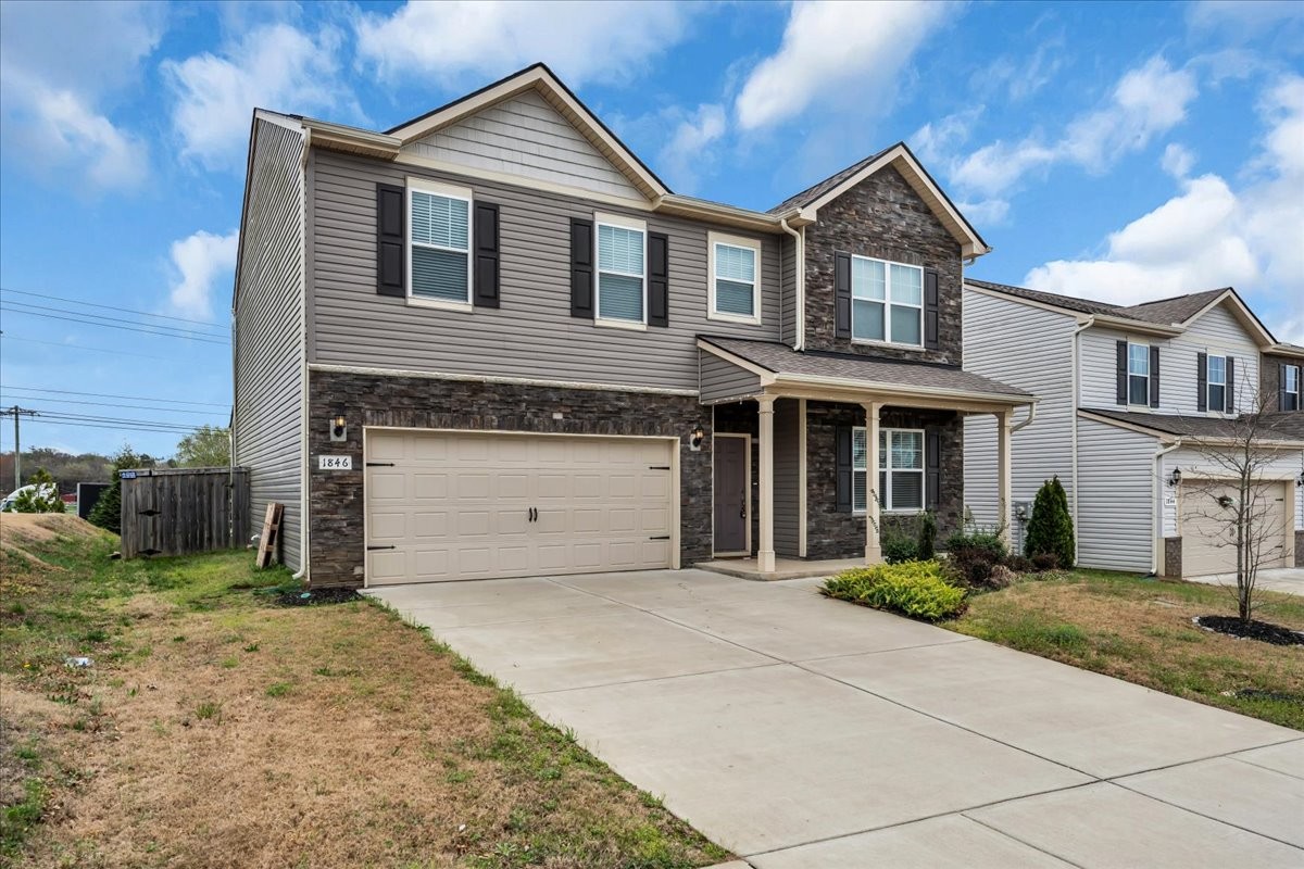 1846 Radnor Road Lebanon, TN 37087 - Photo 4 of 59 a front view of a house with a yard and garage