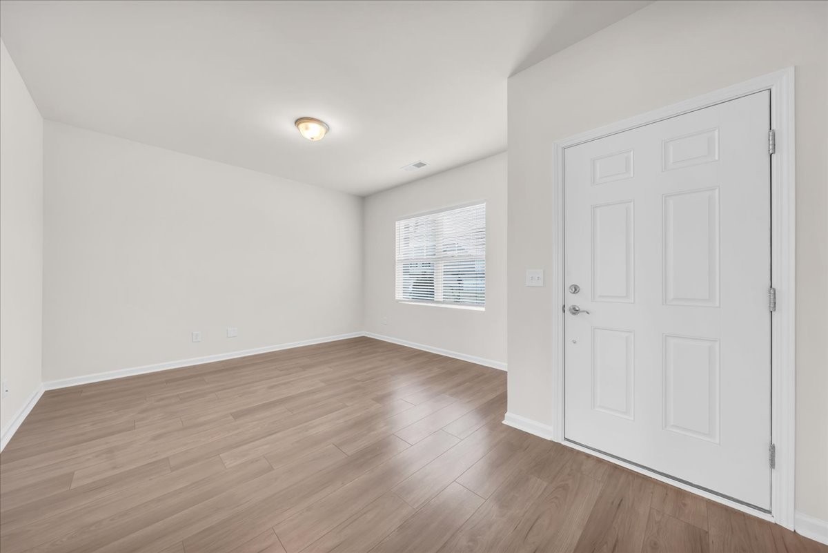 1846 Radnor Road Lebanon, TN 37087 - Photo 10 of 59 a view of an empty room with wooden floor and a window