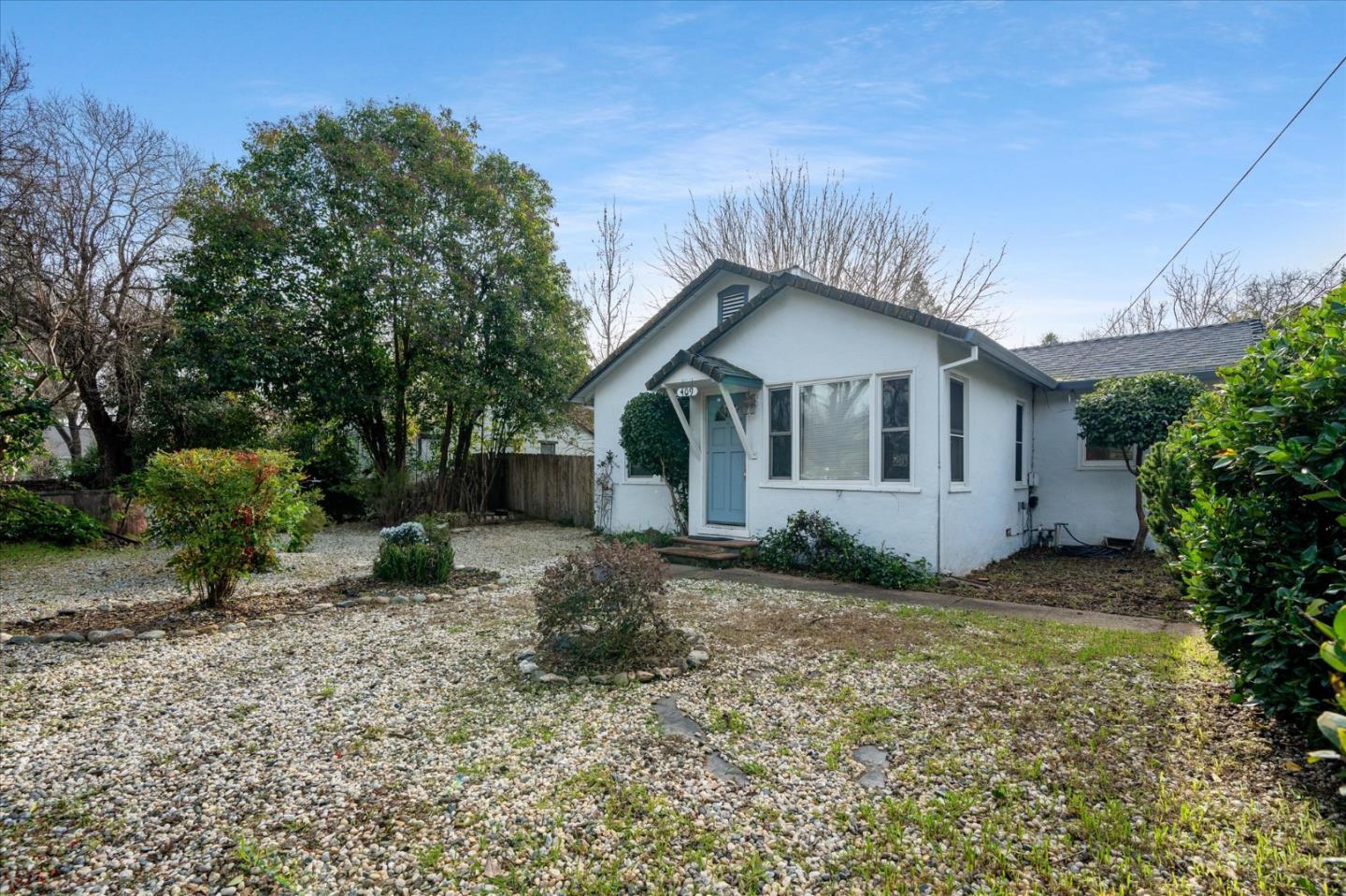 409 Smile Place Redding, CA 96001 - Photo 1 of 1 a view of a house with a yard