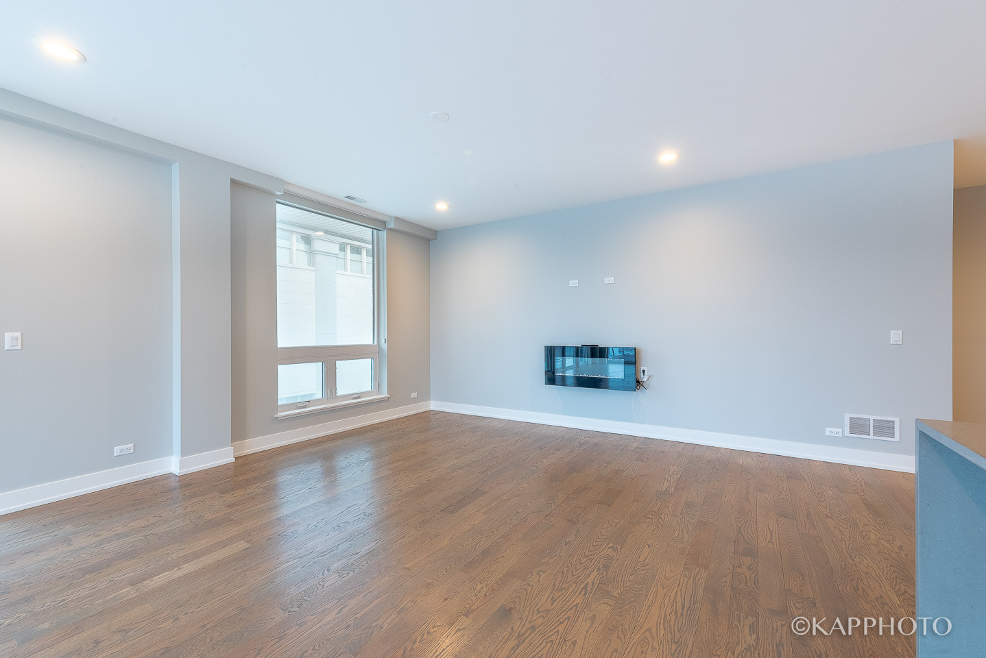 236 South Racine Avenue, Unit 401 Chicago, IL 60607 - Photo 7 of 24 an empty room with wooden floor and windows