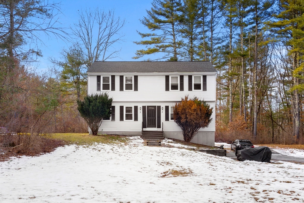 3-5 Roxanne Road Groton, MA 01450 - Photo 1 of 28 a view of a house with a snow in the background