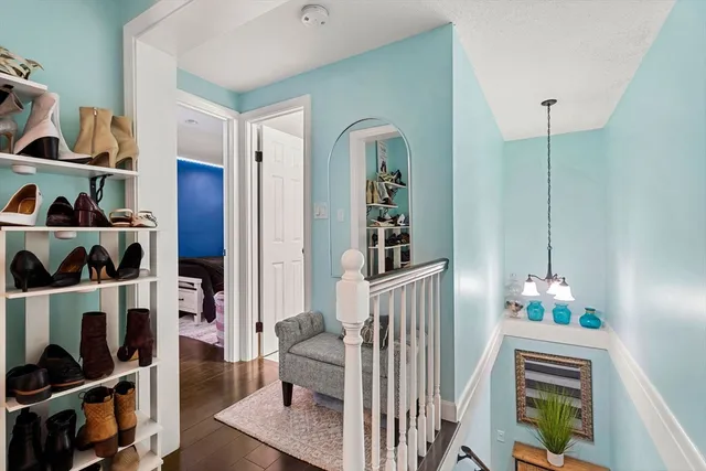 a living room with furniture and a book shelf