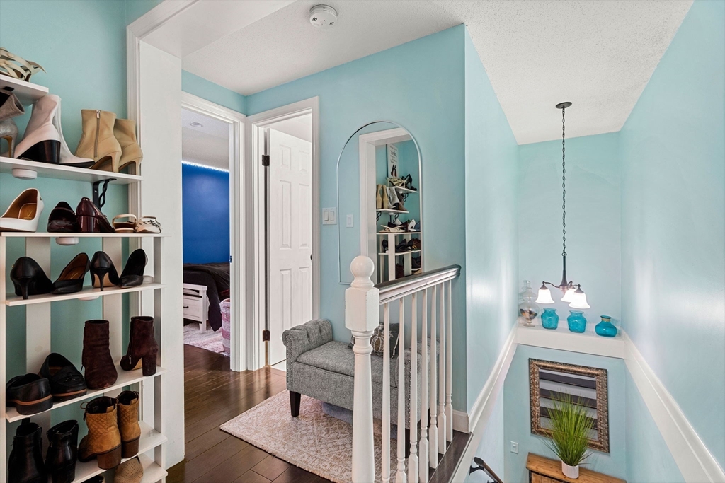 3-5 Roxanne Road Groton, MA 01450 - Photo 11 of 28 a living room with furniture and a book shelf