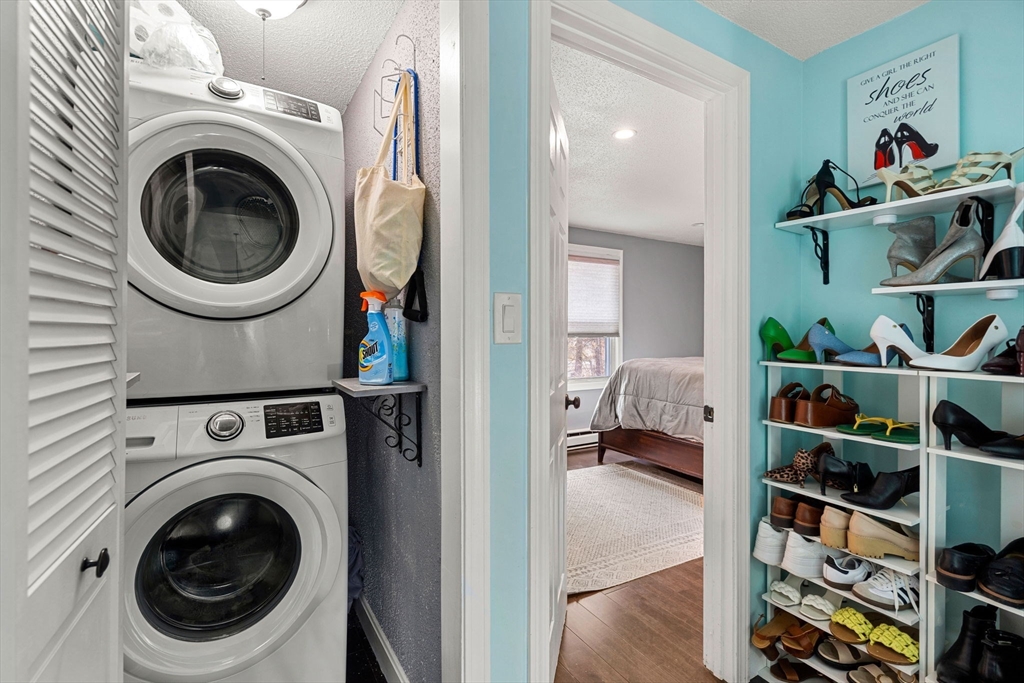 3-5 Roxanne Road Groton, MA 01450 - Photo 12 of 28 a view of a bedroom with washer and dryer