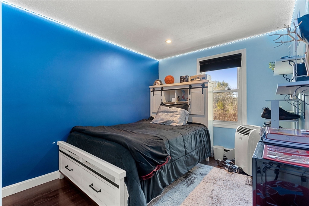 3-5 Roxanne Road Groton, MA 01450 - Photo 13 of 28 a bedroom with a bed and a window