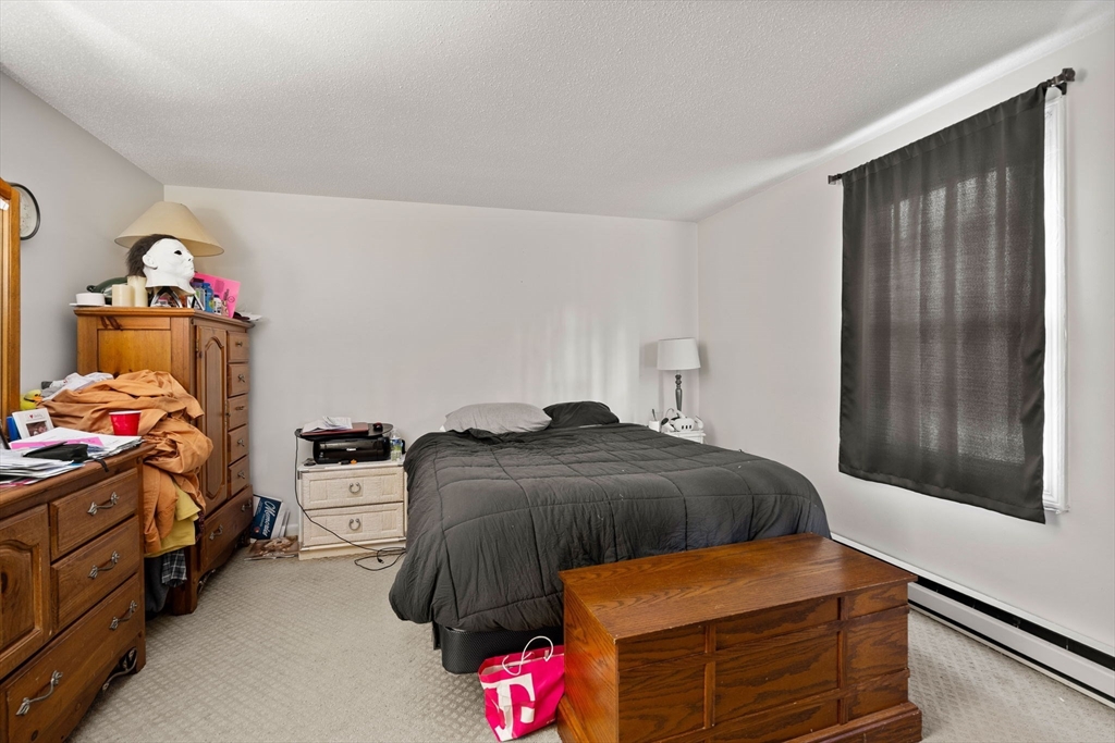 3-5 Roxanne Road Groton, MA 01450 - Photo 20 of 28 a bedroom with a bed and a window