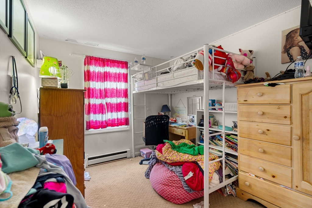 3-5 Roxanne Road Groton, MA 01450 - Photo 22 of 28 a bedroom with a bed and a window