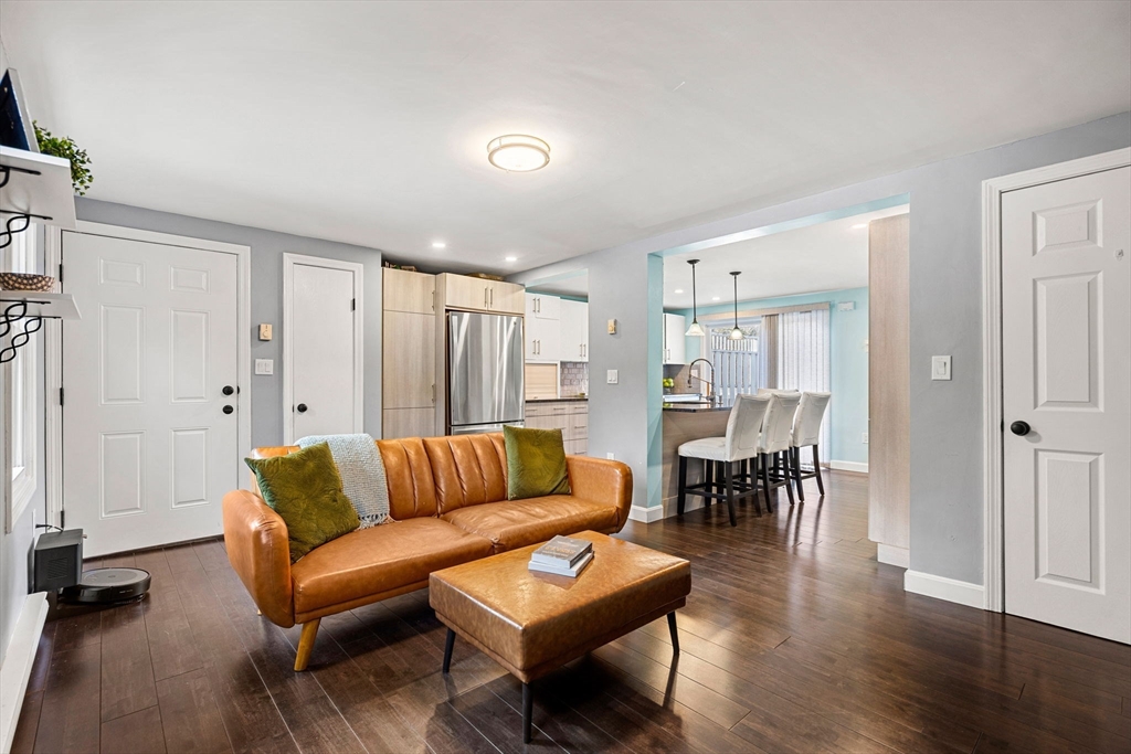 3-5 Roxanne Road Groton, MA 01450 - Photo 5 of 28 a living room with furniture wooden floor and a table