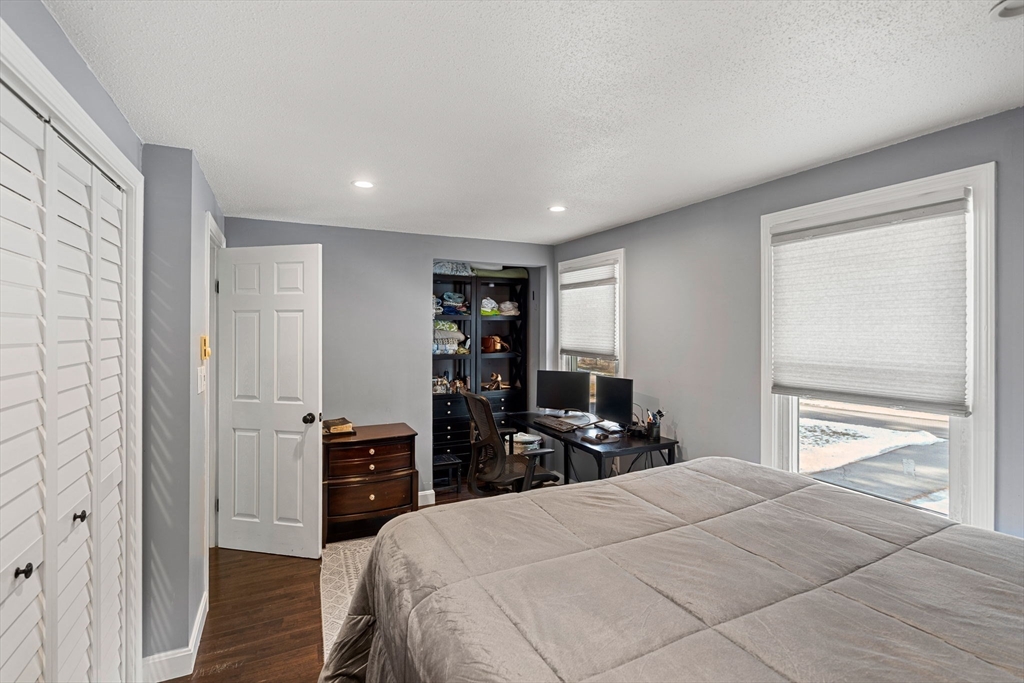 3-5 Roxanne Road Groton, MA 01450 - Photo 9 of 28 a bedroom with a bed and a closet