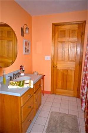 324 High Street Rochester, MA 02770 - Photo 14 of 23 a bathroom with a sink and a mirror