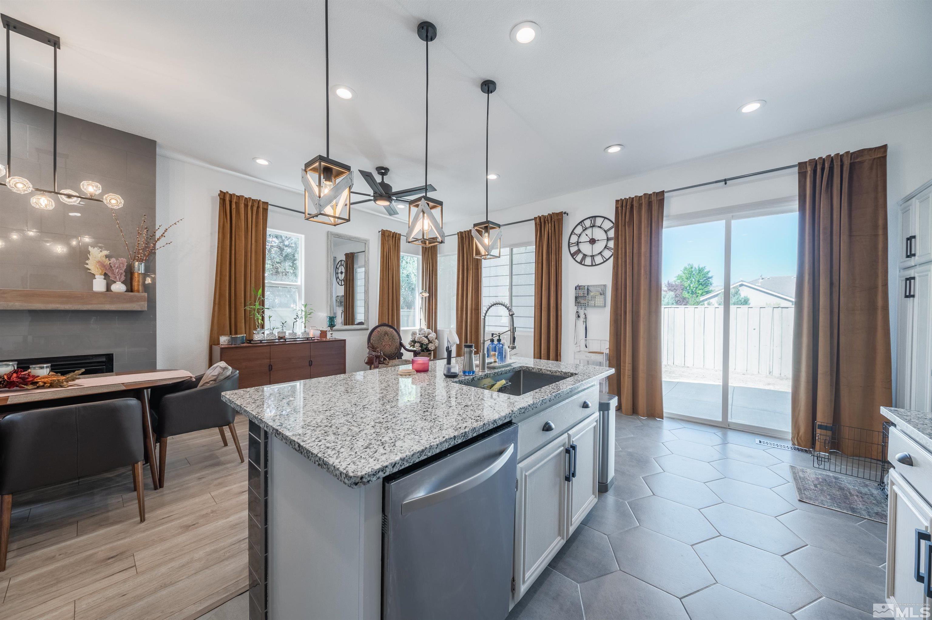 9857 Northrup Drive Reno, NV 89521 - Photo 13 of 27 a large kitchen with granite countertop a sink and a stove