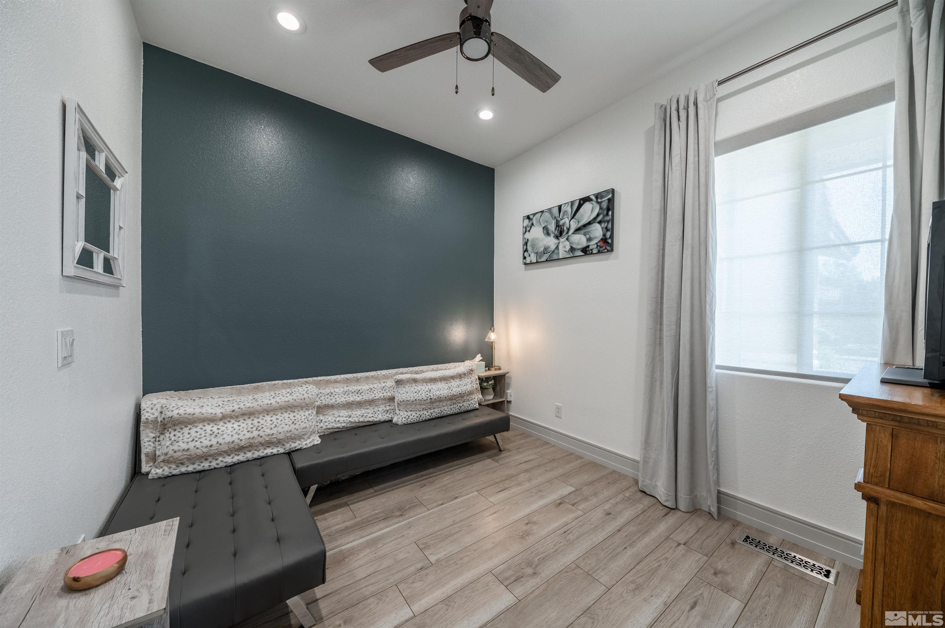 9857 Northrup Drive Reno, NV 89521 - Photo 23 of 27 a view of hallway with stairs and wooden floor