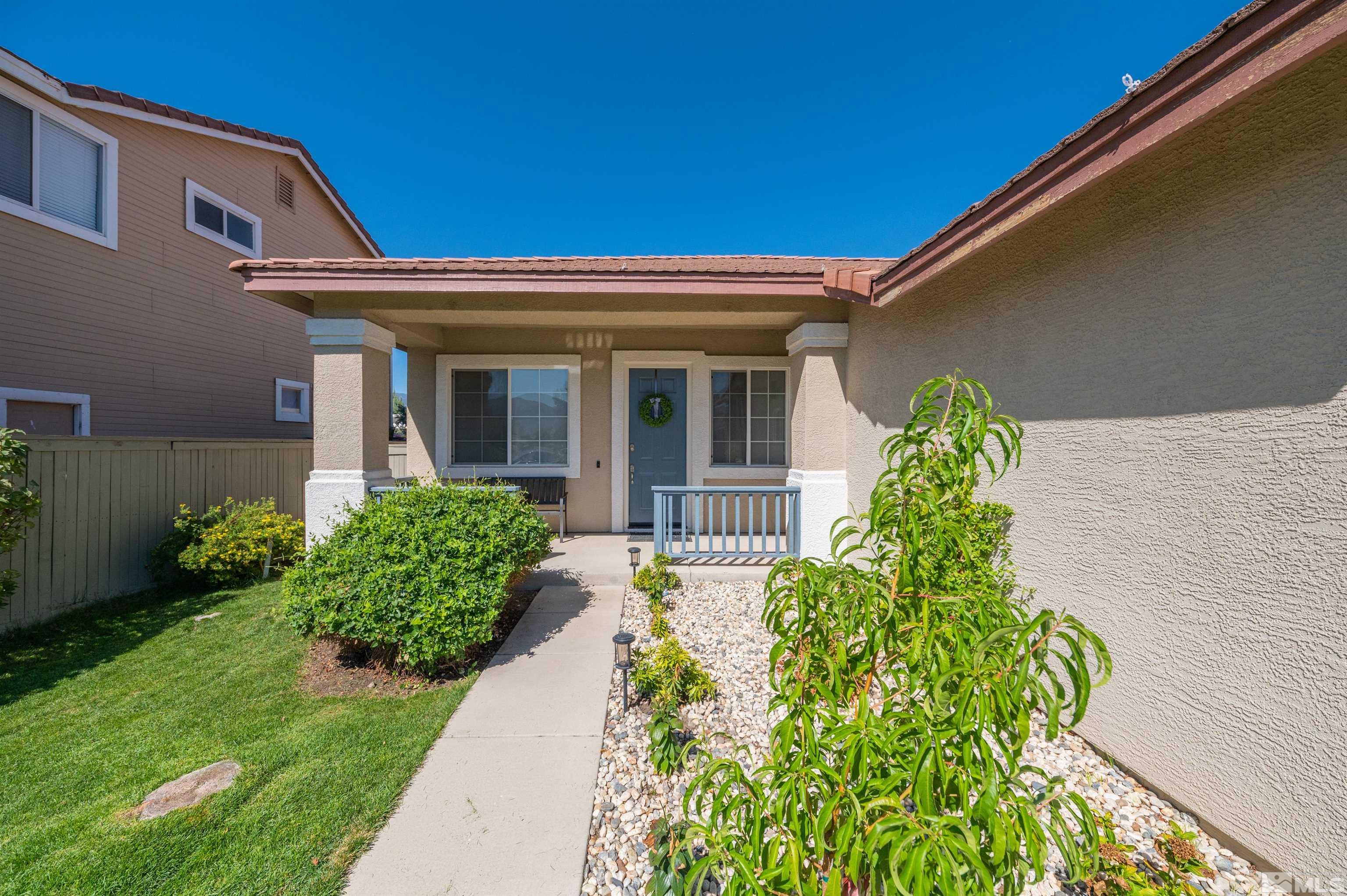 9857 Northrup Drive Reno, NV 89521 - Photo 3 of 27 a front view of a house with garden