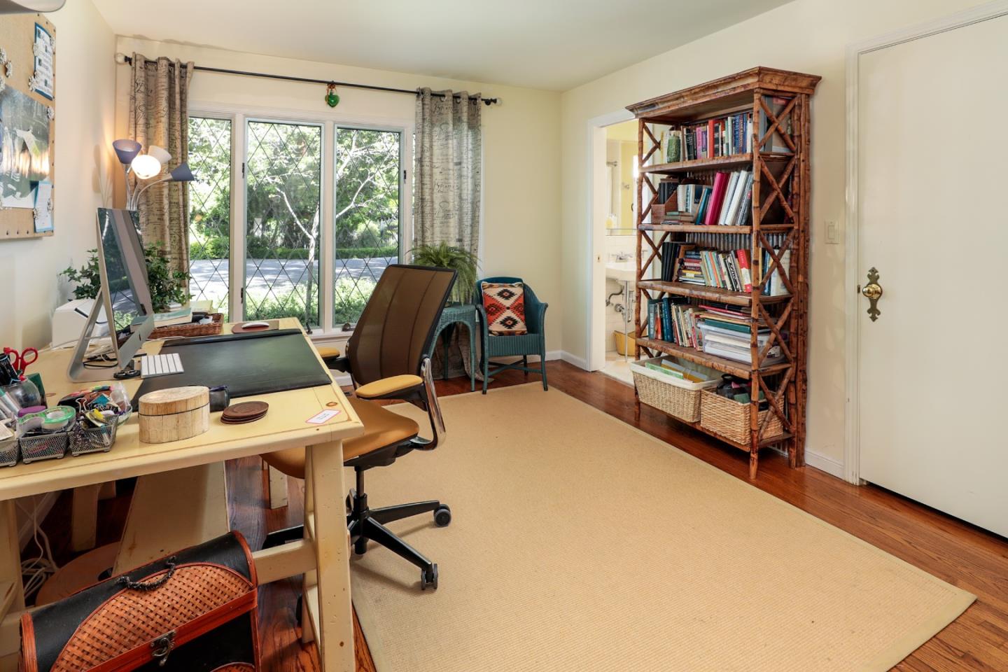 50 Barry Lane Atherton, CA 94027 - Photo 15 of 38 a view of a workspace with furniture and a bookshelf
