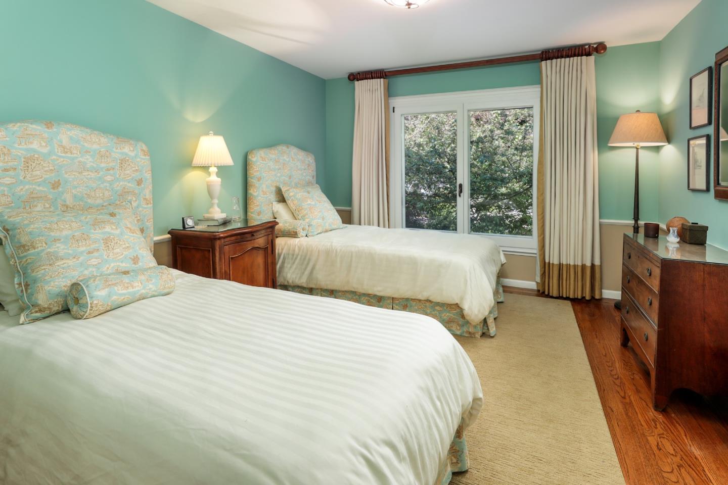 50 Barry Lane Atherton, CA 94027 - Photo 19 of 38 a bedroom with a bed and large windows