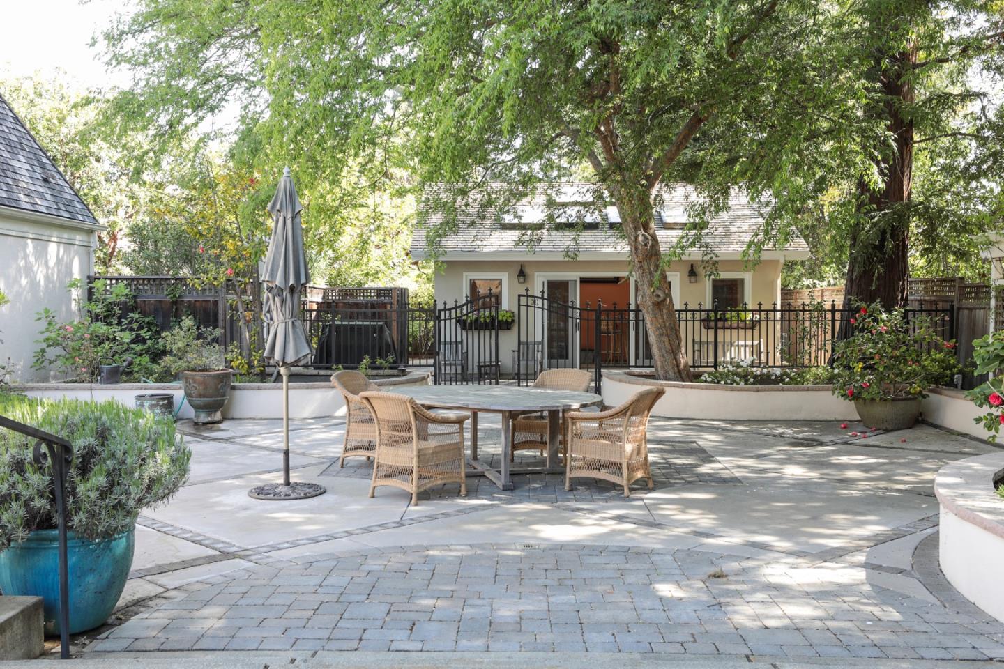 50 Barry Lane Atherton, CA 94027 - Photo 27 of 38 a view of a house with backyard sitting area and garden