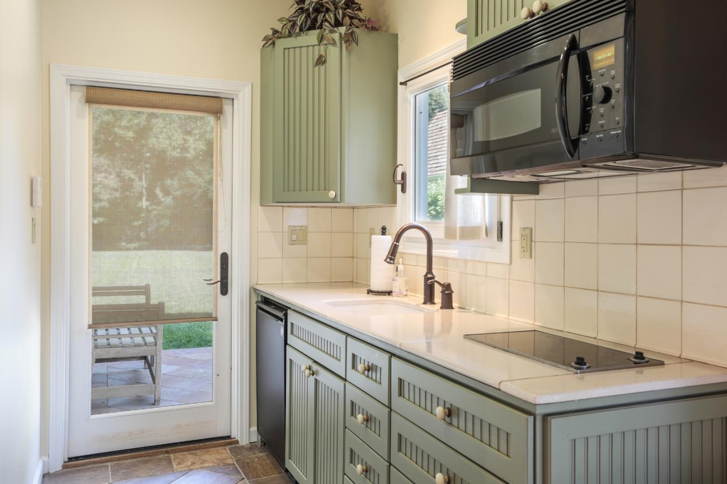 50 Barry Lane Atherton, CA 94027 - Photo 32 of 38 a bathroom with double sink and a mirror