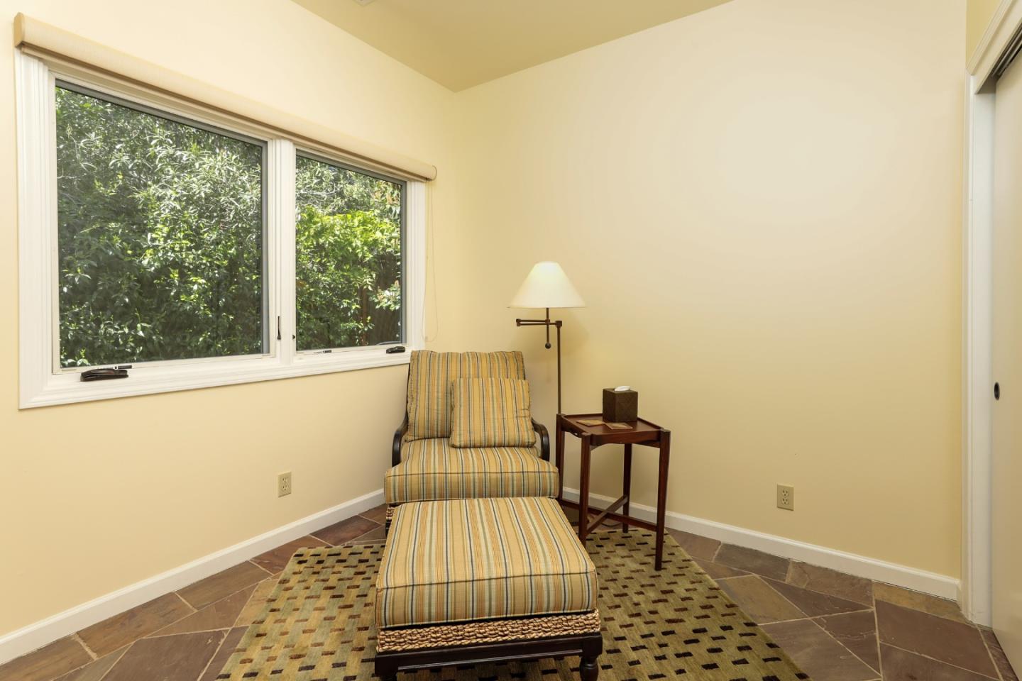 50 Barry Lane Atherton, CA 94027 - Photo 33 of 38 a living room with a chair and a rug