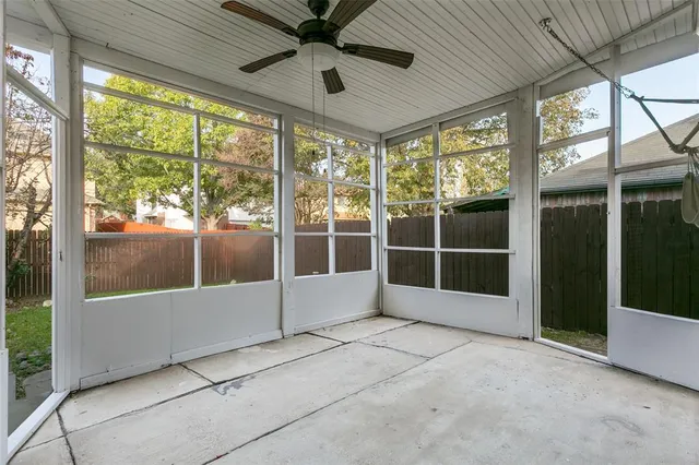 a view of an empty room with a large window
