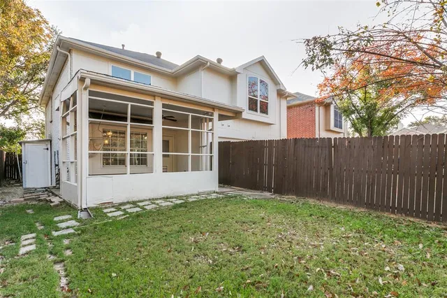 a view of front door of house with yard