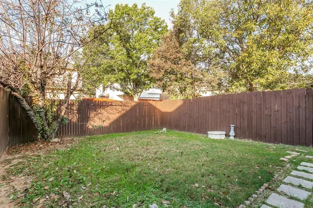 a view of backyard with tree