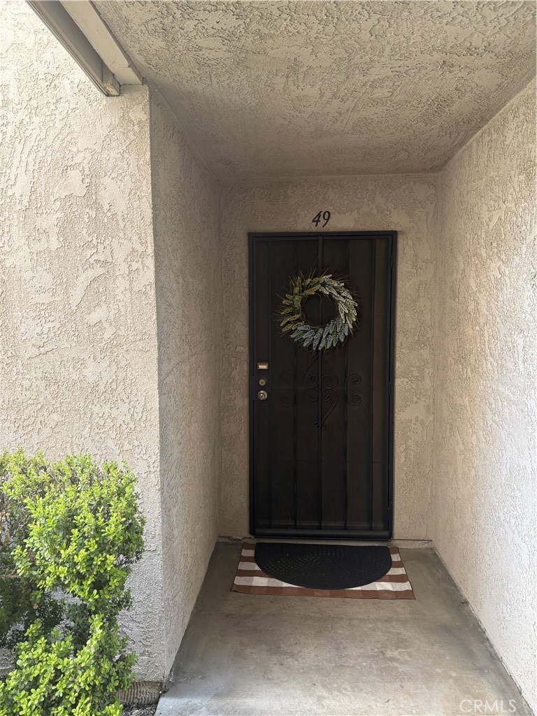 2255 Cahuilla Street, Unit 49 Colton, CA 92324 - Photo 1 of 19 a closeup of a door