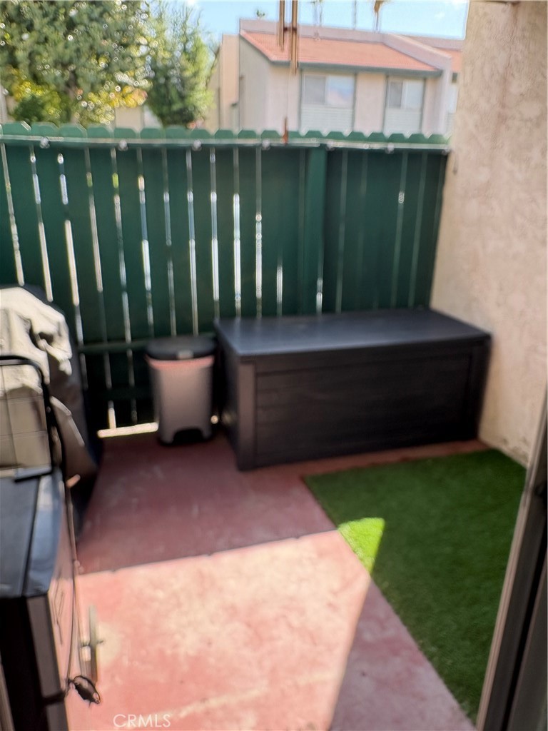 2255 Cahuilla Street, Unit 49 Colton, CA 92324 - Photo 11 of 19 a view of backyard with tub and deck