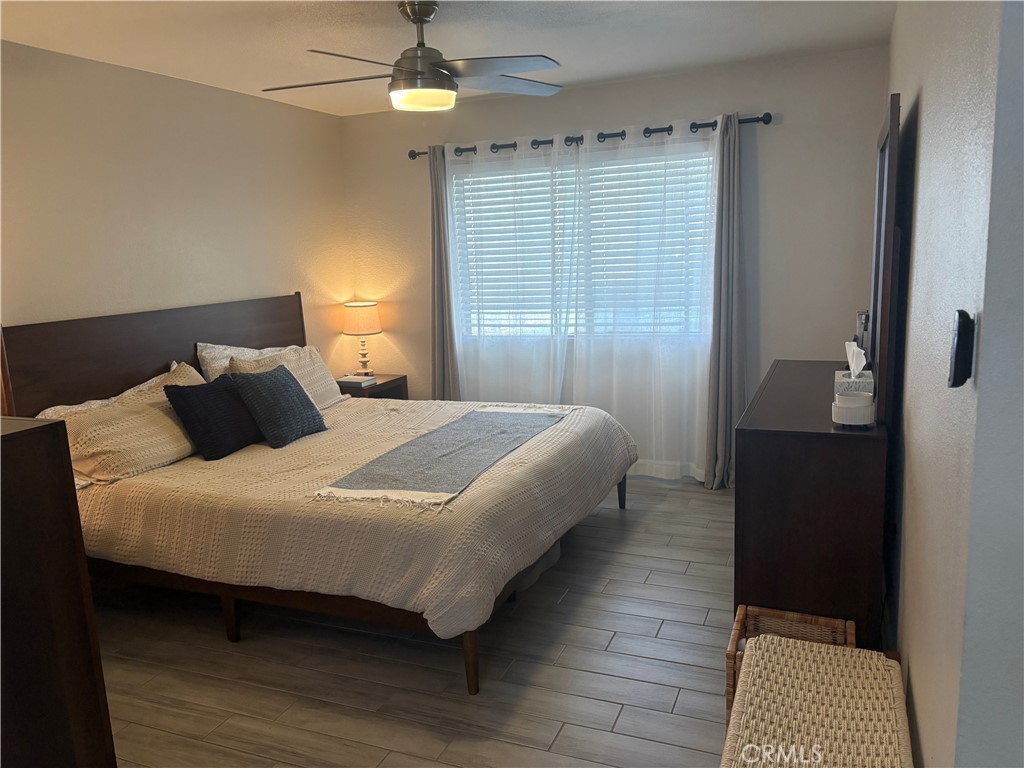 2255 Cahuilla Street, Unit 49 Colton, CA 92324 - Photo 13 of 19 a bedroom with a bed and a walk in closet