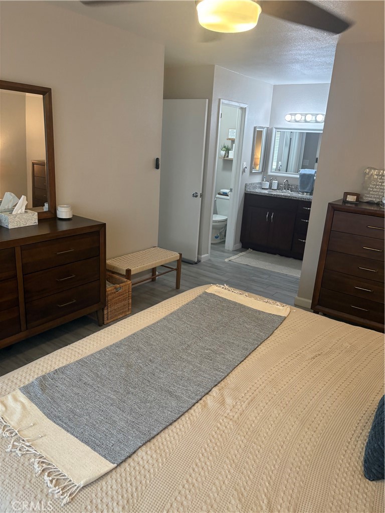 2255 Cahuilla Street, Unit 49 Colton, CA 92324 - Photo 15 of 19 a bedroom with a bed and a dresser