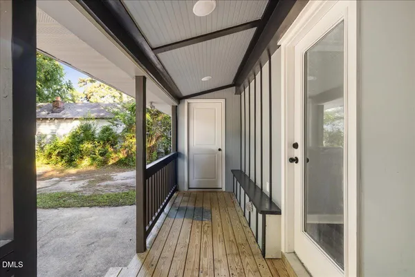 a view of balcony with wooden floor