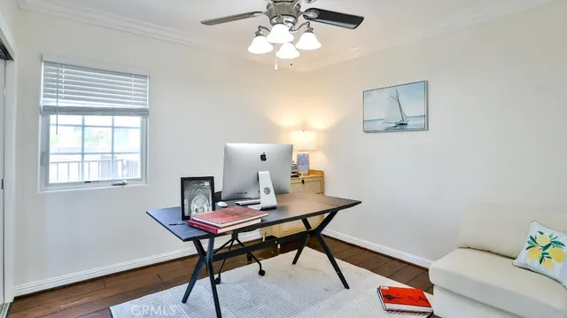 a workspace with furniture and wooden floor