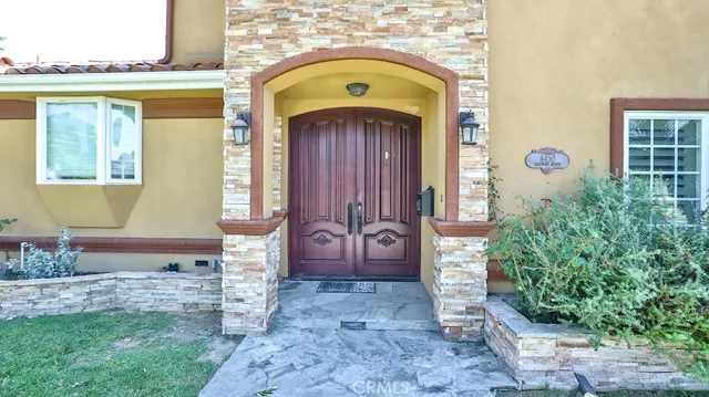 a front view of a house with garden