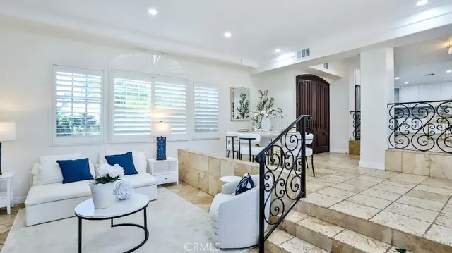 a living room with furniture and white walls