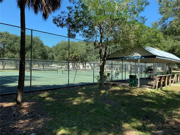 a view of a swimming pool with a patio